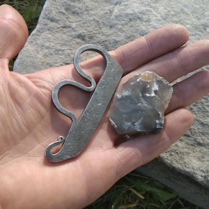 Traditional bushcraft flint and steel. Steel striker and flint.