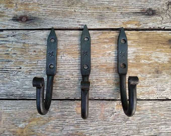 3 forged coat hooks.