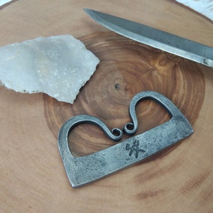 Traditional bushcraft flint and steel. Steel striker and flint.