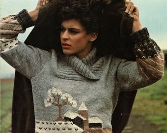 May include: A gray knitted sweater with a brown, beige, and white landscape design. The sweater has a turtleneck collar and a long sleeve.