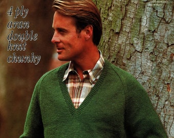 May include: A green knitted sweater with a v-neck and long sleeves. The sweater is made of a chunky yarn and has a relaxed fit.