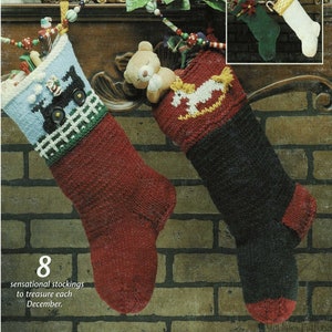 May include: Two knitted Christmas stockings hanging on a brick fireplace mantel. One stocking is red and features a tractor design. The other stocking is black and features a rocking horse design. The text "8 sensational stockings to treasure each December." is printed below the stockings.