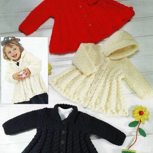 May include: Three knitted baby jackets in red, white, and blue. The jackets have a button closure and a flared skirt.