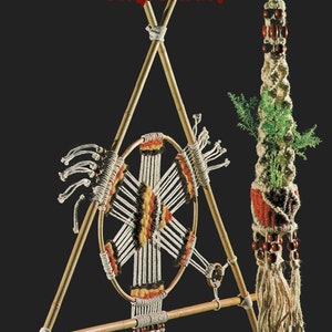 May include: Macrame Emporium text with a macrame wall hanging with a circular design in white, red, yellow, and black thread. The hanging is attached to a wooden triangular frame. A second macrame hanging with a brown and white design is on the right side of the image.