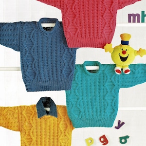 May include: Four knitted jumpers in different colours: pink, blue, teal, and yellow. Each jumper has a cable knit pattern and a round neckline.
