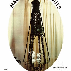 May include: A black macrame plant hanger with a green plant inside, hanging from the ceiling in a room with white curtains. The hanger is suspended over a glass table with two white porcelain birds on it. The image is titled "Macrame Portraits" and "Sir Lancelot" with the text "MP 4" and "Shadows Patterns".