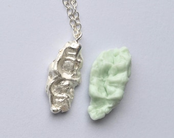 chewed gum necklace, silver pendant with a chain