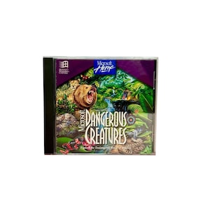 May include: A Microsoft Home "Dangerous Creatures" PC game in a black CD case. The cover art features a roaring bear, a cheetah, and other wildlife in a jungle setting. The text "Explore the Endangered World of Wildlife" is also visible.