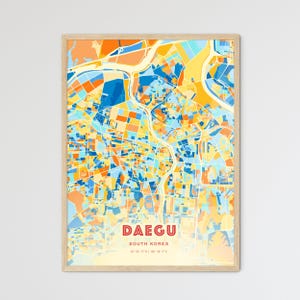 May include: A framed map print of Daegu, South Korea, featuring a colorful abstract design. The map uses a palette of blues, oranges, and yellows. The city name is in red, with the country name and coordinates below.