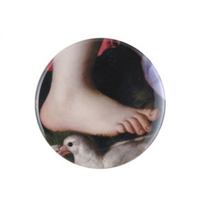 May include: A close-up of a foot stepping on a white dove. The foot is bare and the dove is lying on its side. The background is a dark, blurry image.