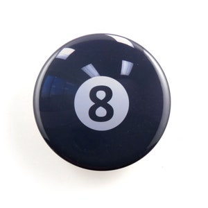 May include: A black and white 8-ball with a white number 8 on a black background.