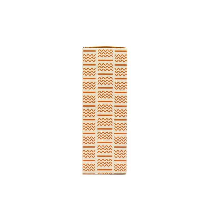 May include: A rectangular box with a repeating pattern of wavy lines and vertical stripes in shades of orange and cream. The box is standing upright against a white background.