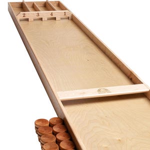 May include: A wooden shuffleboard game with a light wood finish. The game includes a wooden tray with 24 wooden pucks. The game is labelled with the numbers 1, 2, 3, and 4.
