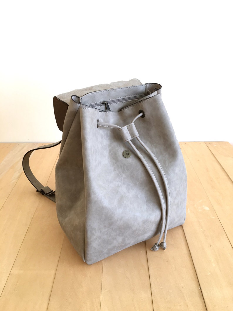 beige backpack leather