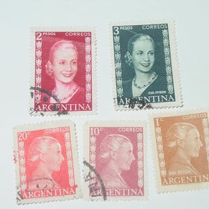 May include: A selection of vintage Argentine postage stamps featuring Eva Perón. The stamps are in various colours, including red, green, and orange, and show the denomination and "CORREOS" text. These stamps are a collectible item.