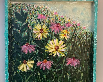 May include: A framed painting depicting a field of yellow and pink flowers with green leaves. The frame is teal blue in colour.