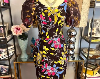 Vestido vintage de algodón con estampado floral de los años 80, mangas abullonadas y cintura ajustada.