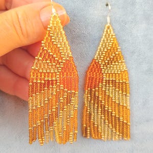 Einzigartige perlen ohrringe orange Native ohrringe rocailles perlen ohrringe leuchter ohrringe perlenarbeit fransen tragbar kunst berg sonne welle sonnenuntergang
