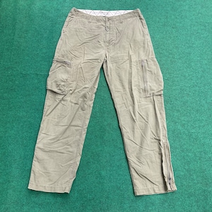 May include: A pair of khaki cargo trousers with multiple pockets and zipped legs.