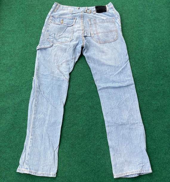 Jeans regular fit com pormenores rotos decorativos - Menino