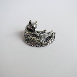Silver cat washing figurine