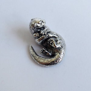 Otter with fish, silver