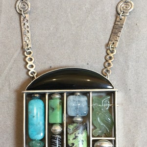 Owl and abacus pendant.