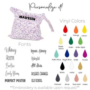 May include: A customizable diaper bag with a floral print and the name "Madysen" embroidered on it. The bag is shown with a variety of font and vinyl color options. The text "Embroidery is available upon request" is also included.