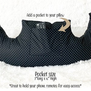 May include: Black pillow with white polka dots, featuring a pocket. The pocket, measuring 7 inches long by 6 inches high, holds a remote control. Text on the image reads, "Add a pocket to your pillow" and "Great to hold your phone, remotes for easy access."