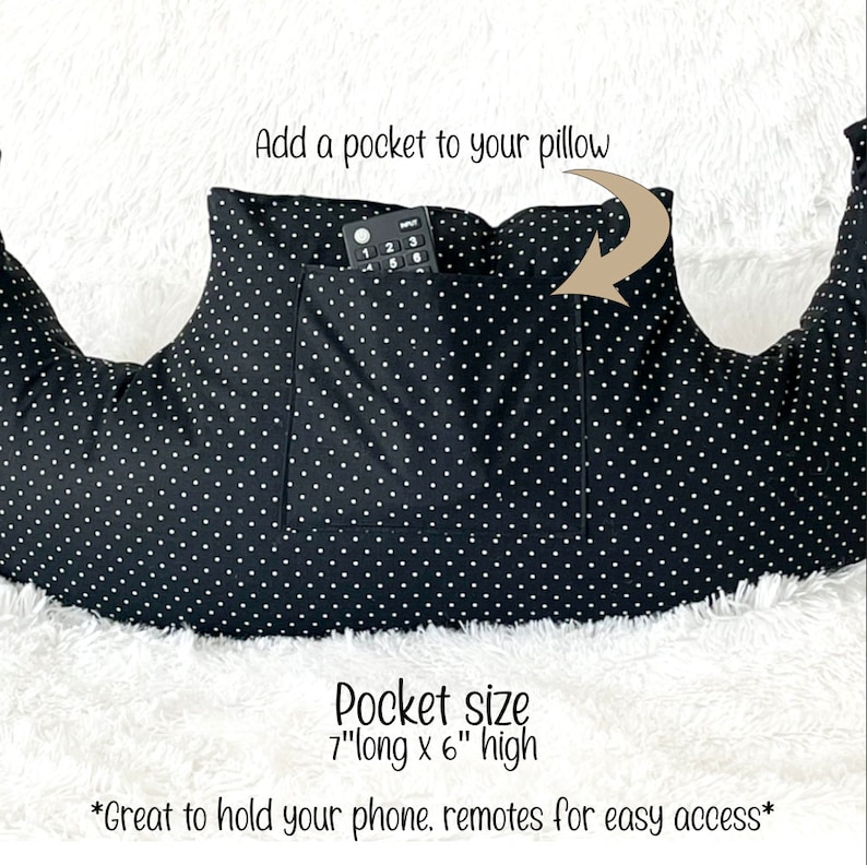 May include: Black pillow with white polka dots, featuring a pocket. The pocket, measuring 7 inches long by 6 inches high, holds a remote control. Text on the image reads, "Add a pocket to your pillow" and "Great to hold your phone, remotes for easy access."