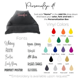 May include: A black and gray wedge pillow with the word "Jennifer" embroidered in pink. The image shows a variety of font and vinyl color options for personalization. The text "Personalize it!" is at the top of the image. The text "Embroidery is available upon request" is at the bottom of the image.