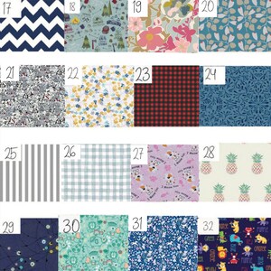 May include: A collection of 32 fabric swatches with various patterns, including geometric, floral, and animal prints. The swatches are numbered 17 through 32.