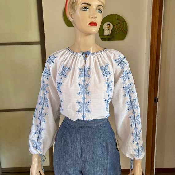 1960s vintage white peasant blouse with blue embroide… Gem