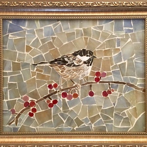 May include: A mosaic artwork depicting a small bird perched on a branch with red berries. The bird is brown and white with a black head. The background is a mosaic of blue, gray, and brown tiles.