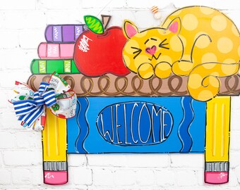 Cute Back to School Wooden Door Hanger: Snuggly Cat Sleeping on Teacher&#39;s Desk with books, pencils and an apple. PREORDER brand new design!
