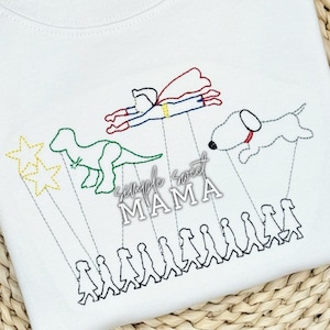 May include: Embroidered design on a white t-shirt featuring a superhero flying, a dinosaur, a dog, and a line of people walking. The text "Simple Sweet Mama" is also embroidered on the shirt.