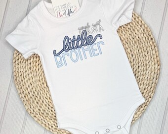 May include: White baby bodysuit with blue and gray embroidery that reads "little brother".