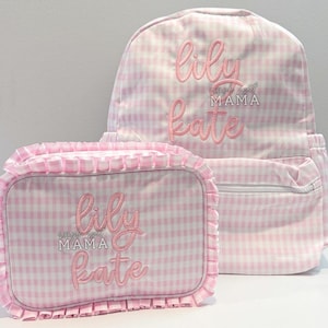 May include: Pink and white gingham backpack and matching lunch bag with the embroidered text "lily" and "world's best mama kate".