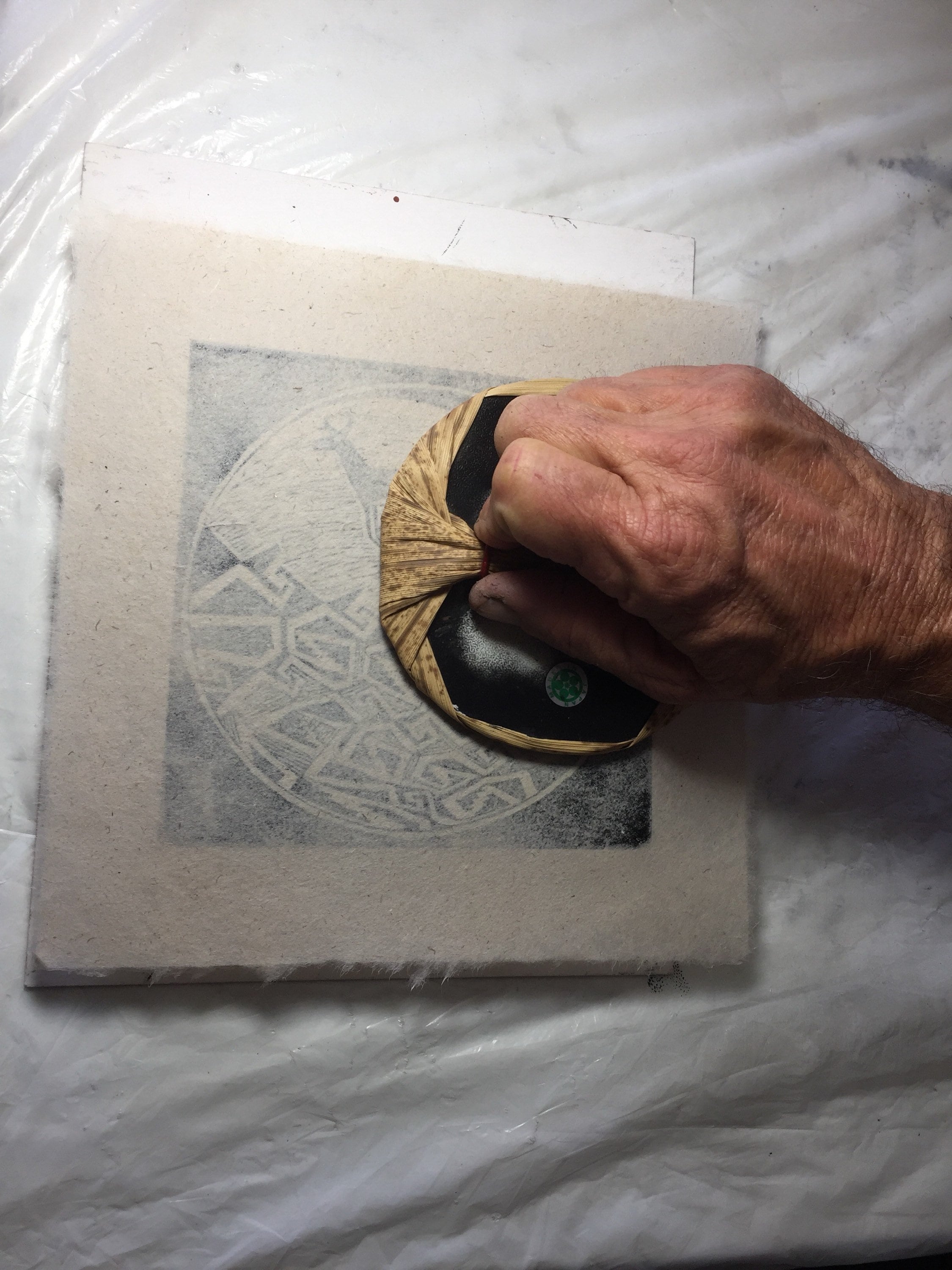 This is a block print of The Hand and Spiral on handmade paper by Michael Colombo and Barbara Barkley