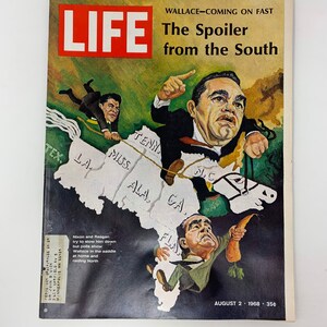 May include: A LIFE magazine cover from August 2, 1968, featuring a caricature of George Wallace riding a horse over a map of the Southern United States. The headline reads "The Spoiler from the South".