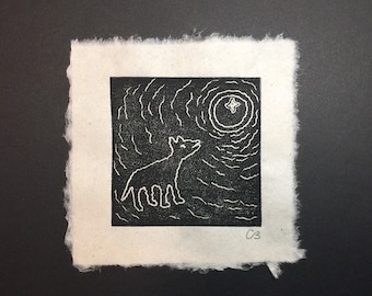 Block print of a Petroglyph - "A Wolf Howling at the Moon" on handmade paper by Michael Colombo and Barbara Barkley