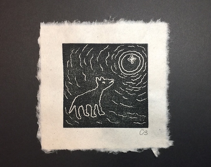 Block print of a Petroglyph - "A Wolf Howling at the Moon" on handmade paper by Michael Colombo and Barbara Barkley