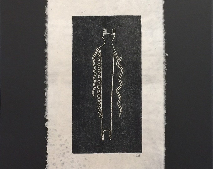 Block print of a pictograph on handmade paper by Michael Colombo and Barbara Barkley