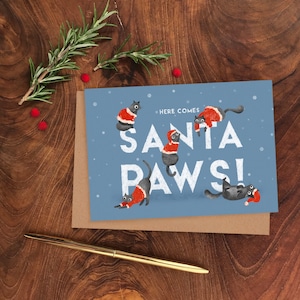 Ilustrowana kartka świąteczna Santa Paws, kartka z pozdrowieniami Świętego Mikołaja z kotem, zabawna kartka świąteczna z kotem, kartka świąteczna