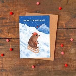 Carte de Noël A6 ours faisant de la luge / carte de voeux de vacances animal illustrée / carte d'illustration mignonne scène de neige