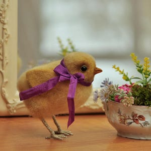 Cute fluffy chick with a gift Easter egg Realistic yellow needle felted Easter chick Little wool chick figurine for spring & Easter décor