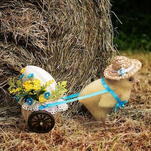 Felted Easter chick pulling a cart with an egg Yellow chick and a floral egg trolley from an old postcard Vintage-inspired chick figurine