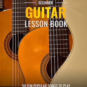 May include: A beginner guitar lesson book with a close-up of three acoustic guitars. The book cover features the text "Beginner Guitar Lesson Book" and "50 Fun Popular Songs to Play".