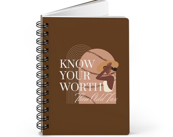 May include: A brown spiral bound notebook with the text "KNOW YOUR WORTH then Add Tax" and a drawing of a woman wearing a hat and a white top.