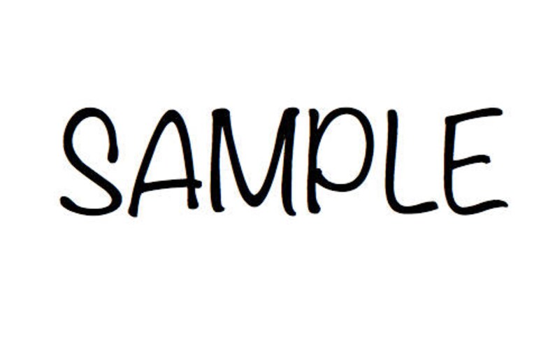 May include: The word "SAMPLE" written in black cursive lettering.